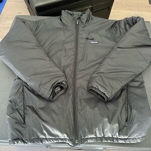 Patagonia Men’s Micro Puff® Jacket in Black, Size L
No damage, all zippers work.